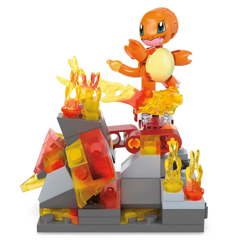 Mega Pokémon Charmander spinning on a fiery battle platform built from interlocking bricks, surrounded by translucent red and yellow flame pieces and rocky gray terrain.