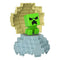 Minecraft Mini Mode Creeper toy posed on an opened blue-and-yellow pixel-style spawn egg, highlighting its collectible design and blocky texture inspired by the video game’s signature aesthetic.
