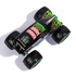 Top view of Monster Jam Grave Digger diecast truck, featuring bold green flames, skull artwork, and red “Grave Digger” lettering across the black roof design.