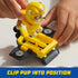 Child clips PAW Patrol Rubble figure into yellow hoverboard with black fans, demonstrating secure placement and action-ready setup.