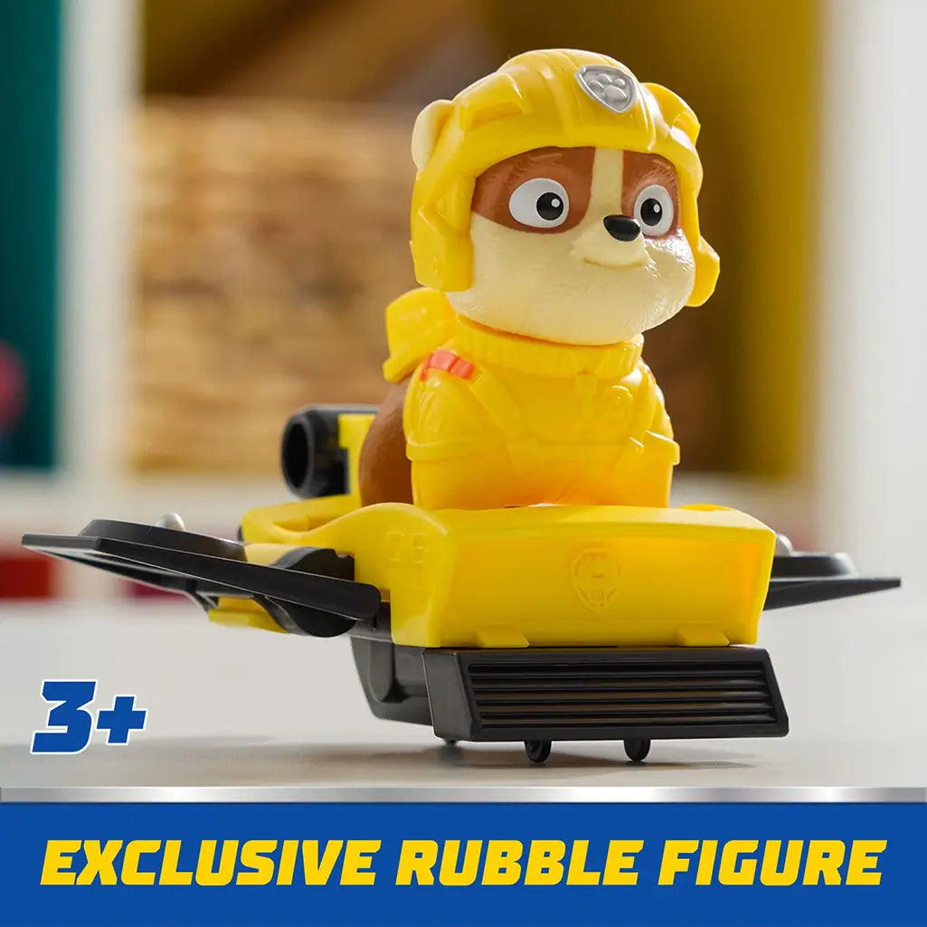 Close-up of exclusive PAW Patrol Rubble action figure seated in yellow hoverboard with black wings, designed for preschool adventure play.
