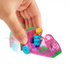 Hand pushing Polly Pocket pink watermelon car with green trim, seated Polly doll, and blue hippo figure, demonstrating toy in action on white background.