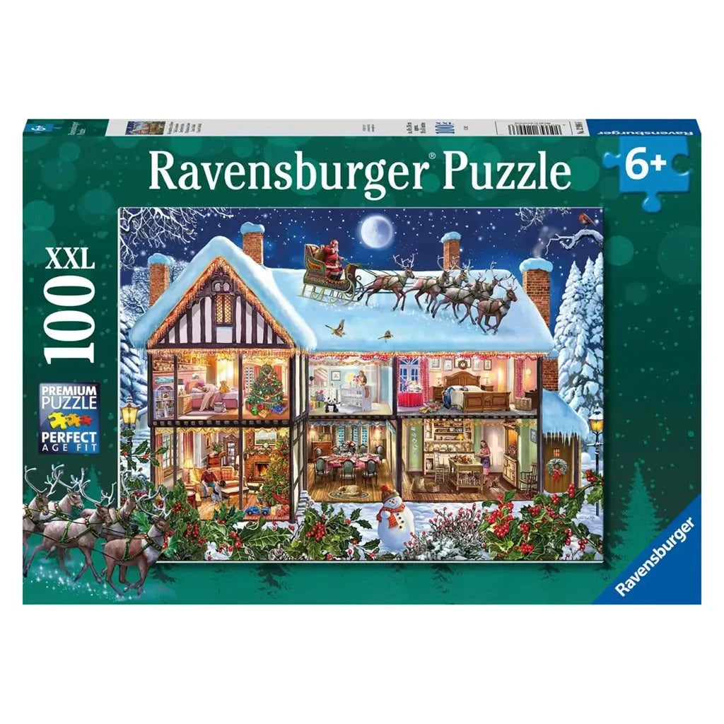 Front of Ravensburger Christmas at Home puzzle box with 100 XXL pieces, featuring a holiday house scene and Santa flying over a snowy rooftop at night.