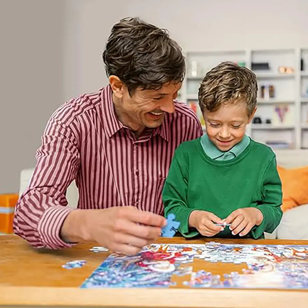Smiling father and son sitting at wooden table, assembling a Ravensburger Encanto puzzle together, enjoying family bonding while piecing together the colorful Disney scene.