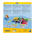 Back of Ravensburger HIT game box with detailed multilingual descriptions, illustrated board setup, colorful pawns, cards, tokens, and family play instructions.