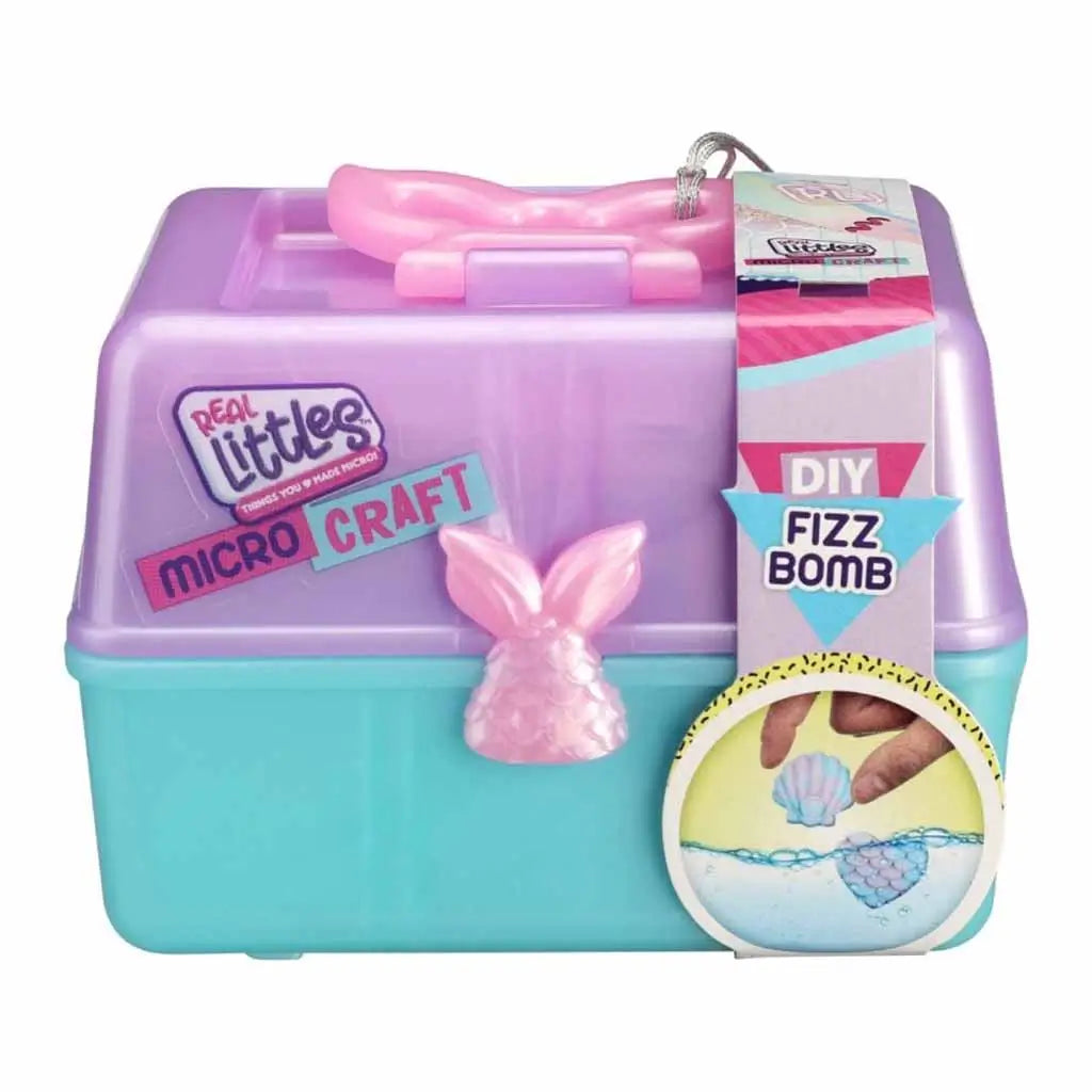 Real Littles Micro Craft DIY Fizz Bomb kit in pastel purple and teal box with pink mermaid tail handle, designed for making mini bath fizz bombs at home, displayed with product label.
