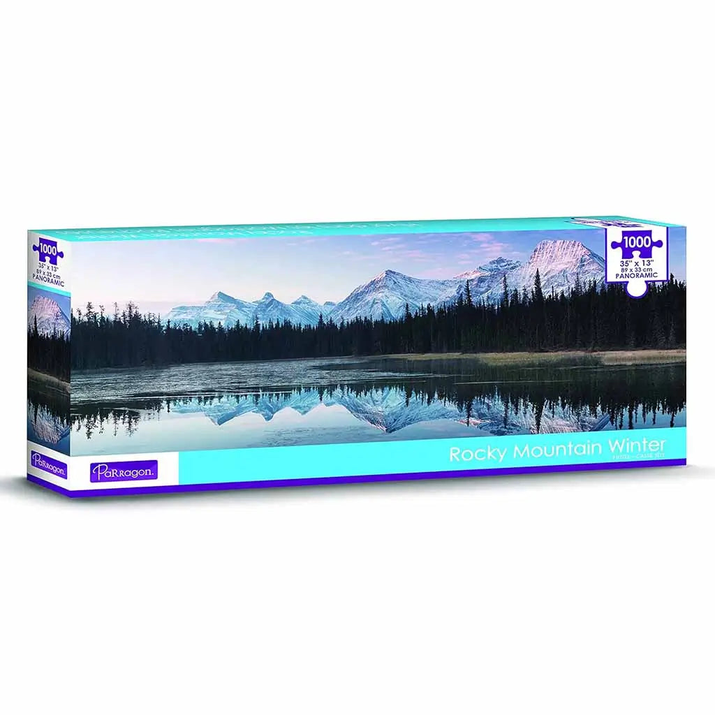 Parragon 1000-piece panoramic jigsaw puzzle box titled 'Rocky Mountain Winter' featuring a tranquil lake reflection of snowy peaks and pine forest, designed for scenic nature puzzle enthusiasts.