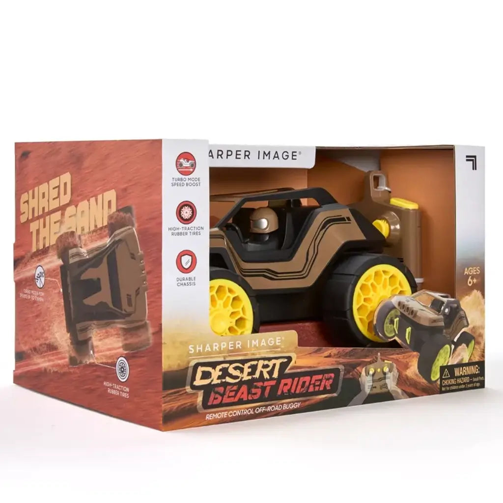Front packaging view of Sharper Image Desert Beast Rider RC off-road buggy displaying the toy inside box with yellow wheels, remote control, and labeled features like turbo speed boost.