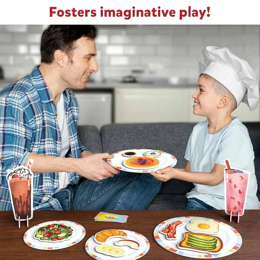 A father and son smiling while pretending to serve magnetic play food from the Skillmatics Rainbow Diner set, demonstrating creativity and social interaction in an at-home restaurant play scene.
