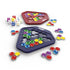 Genius Gems board game set with red and blue hexagonal trays, jewel-shaped colorful pieces, and multiple white dice arranged neatly against a white surface.