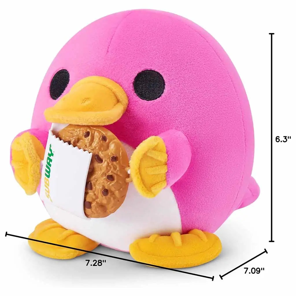 Side view of Snackles Series 2 pink platypus plush with Subway cookie showing product dimensions of 6.3 inches tall and about 7 inches wide, perfect for cuddling and display.
