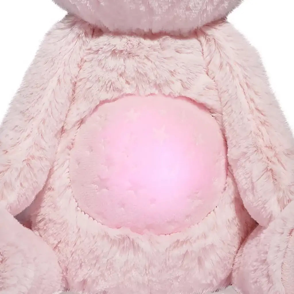 Plush unicorn cat toy’s glowing pink belly with faint star patterns on its soft fur, designed to light up gently for nighttime comfort.
