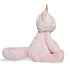 Fuzzy pastel pink unicorn cat plush with golden horn and long fluffy tail shown from the left side, highlighting its soft, huggable texture.