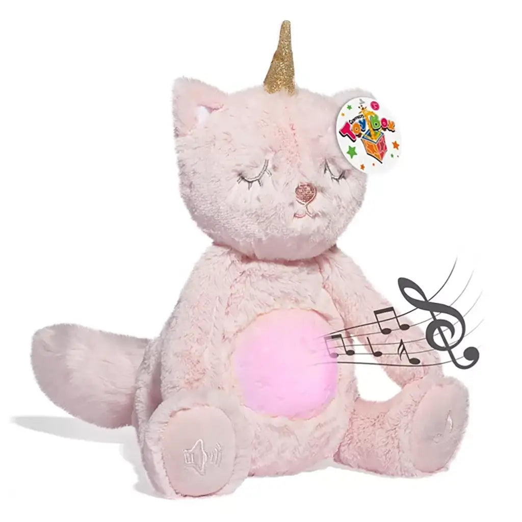 Musical unicorn cat plush toy in light pink fabric with gold horn, glowing pink belly, and embroidered face, shown emitting music notes.