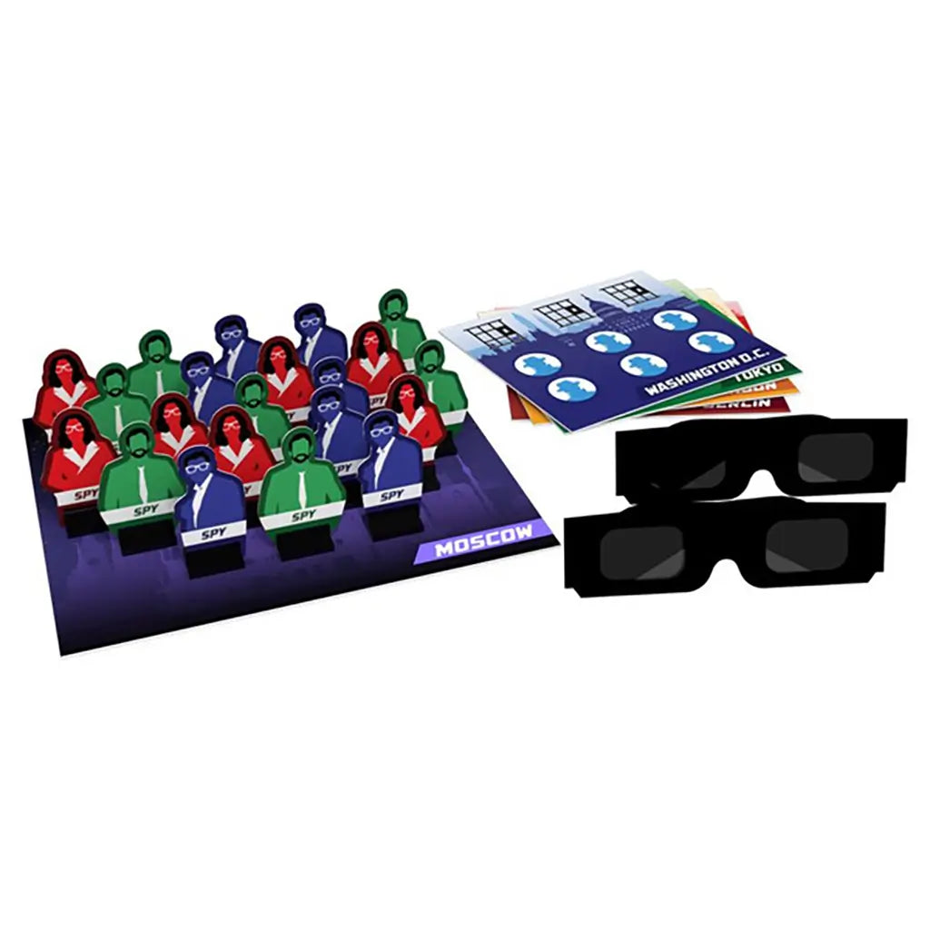 Complete Spy Vision board game set by Goliath showing colorful spy character pieces in red, blue, and green, city mission cards, and black spy glasses used for decoding clues during gameplay.