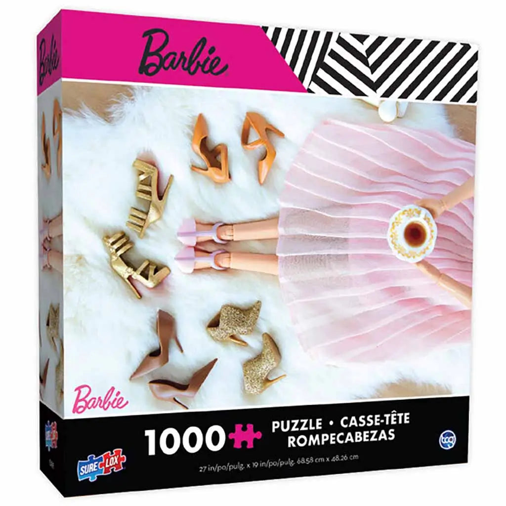 Sure-Lox 1000-piece Barbie puzzle box showing a Barbie doll in a pink pleated skirt holding a teacup, surrounded by assorted gold, tan, and pink high-heeled shoes on a white fur surface.