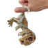 Smiling child holding the Untamed Fingerlings Doom Skeleton Dinosaur on his finger, demonstrating the toy’s interactive motion and fun ferocious personality for kids aged five and up.