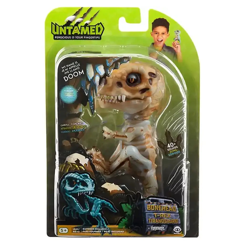 Untamed Fingerlings Doom Skeleton Dinosaur toy in original packaging, showing bone-colored T-Rex design with interactive features and over 40 sound effects for playful finger-controlled action.