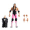 WWE Elite Bret Hart figure with interchangeable hands, black singlet, pink tights, white boots, and included Howard Finkel build-a-figure tuxedo vest accessory.