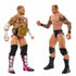 WWE action figures of CM Punk in pink trunks with championship belt and Randy Orton in black trunks face off, showing tattoo details and ring-ready poses on white background.
