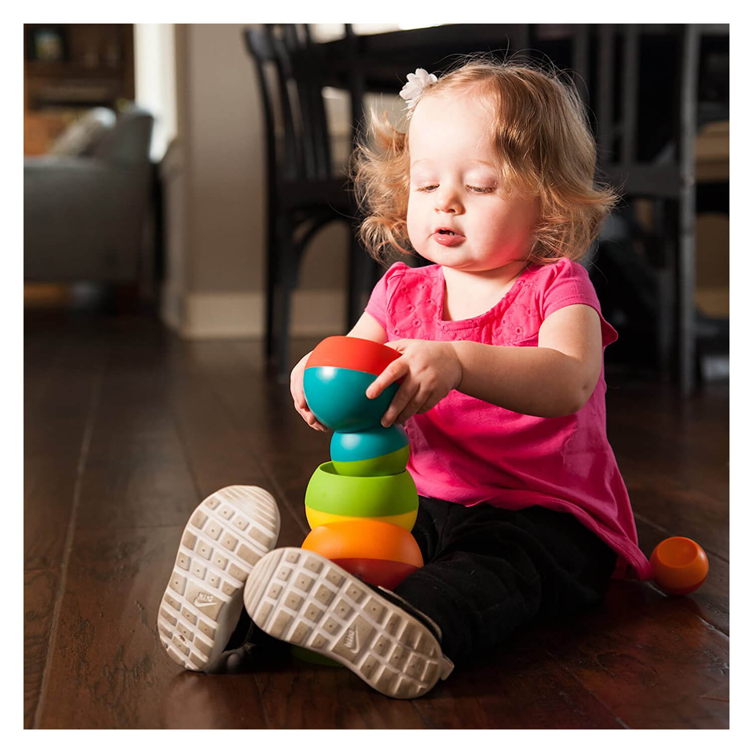 Little girl playing with the tobbles.