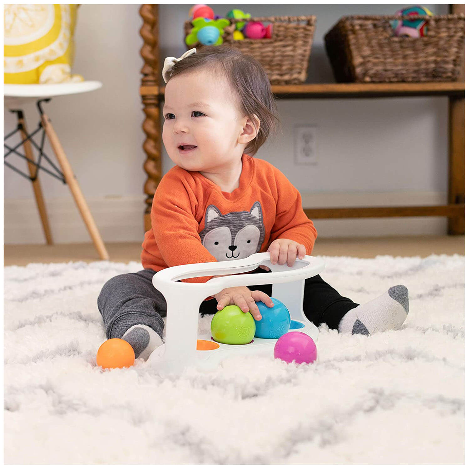 Baby playing with the toy.