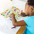 Melissa and Doug Sticker Collection Dinosaurs Vehicles Space and More Sticker Book child playing with sticker page