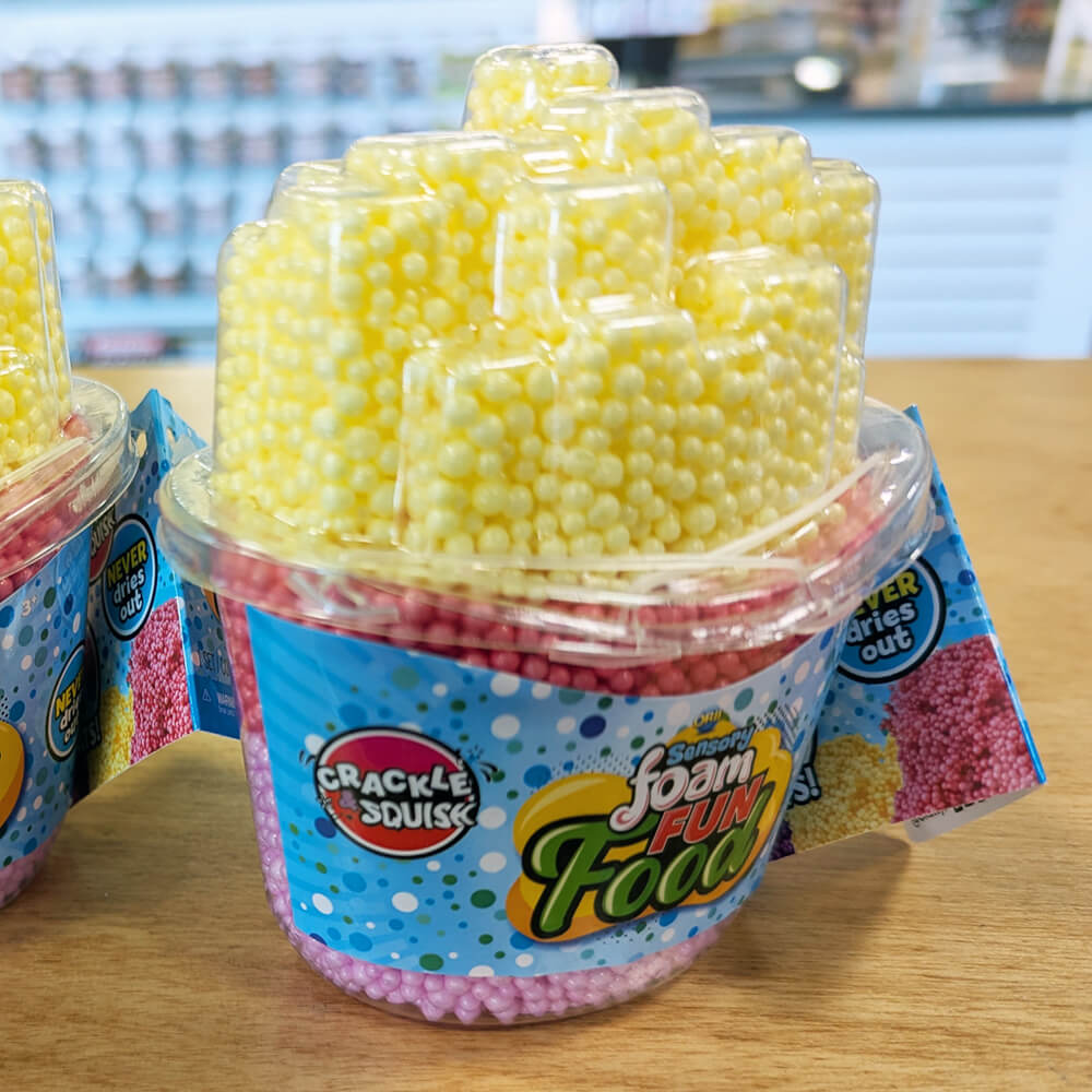 Orb Sensory Foam Fun Food French Fries in Yellows and pinks, on display.